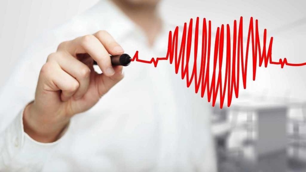 Clinician discussing heart test results with a patient